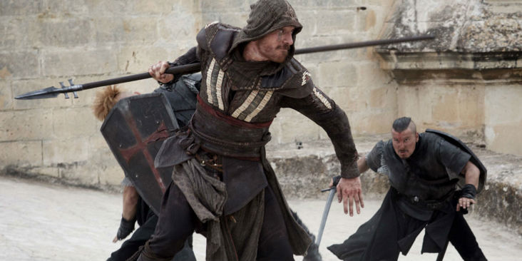 Michael Fassbender holding a spear.